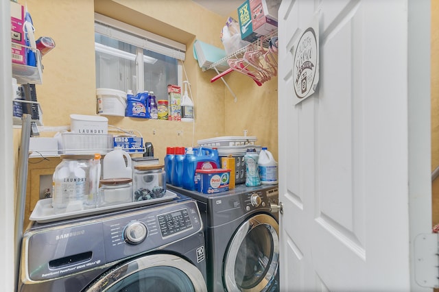 washroom featuring laundry area and separate washer and dryer