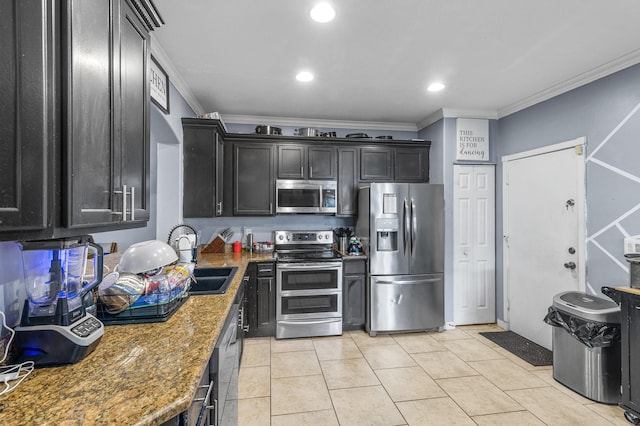 kitchen featuring light tile patterned floors, appliances with stainless steel finishes, a sink, and ornamental molding