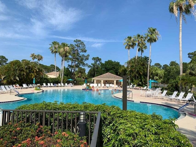 community pool with a patio area