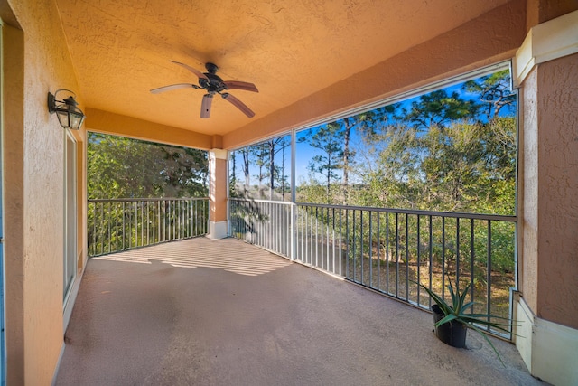 view of patio / terrace with ceiling fan and a balcony