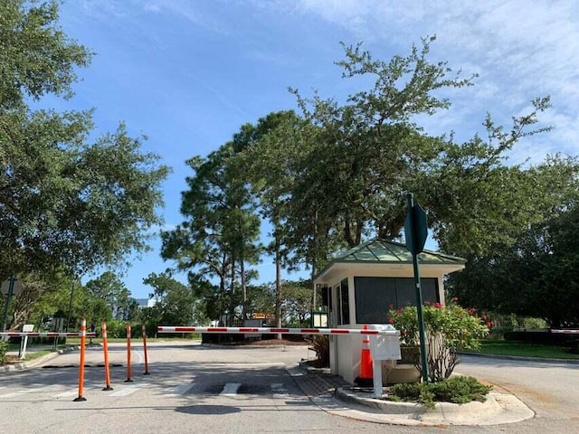 view of road with traffic signs and curbs