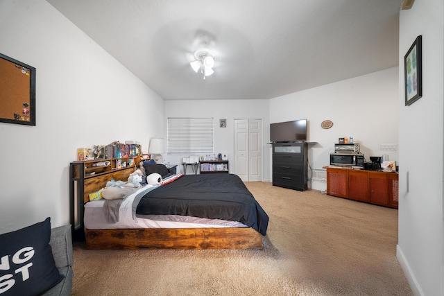 bedroom with baseboards, light colored carpet, and ceiling fan