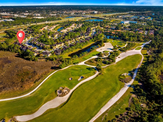 aerial view with a water view and view of golf course