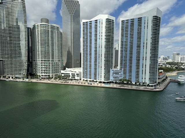 aerial view featuring a water view and a view of city