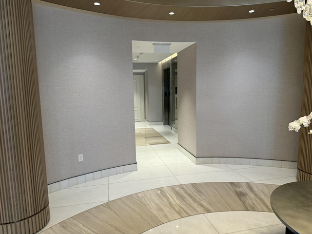 interior space featuring recessed lighting and light tile patterned floors