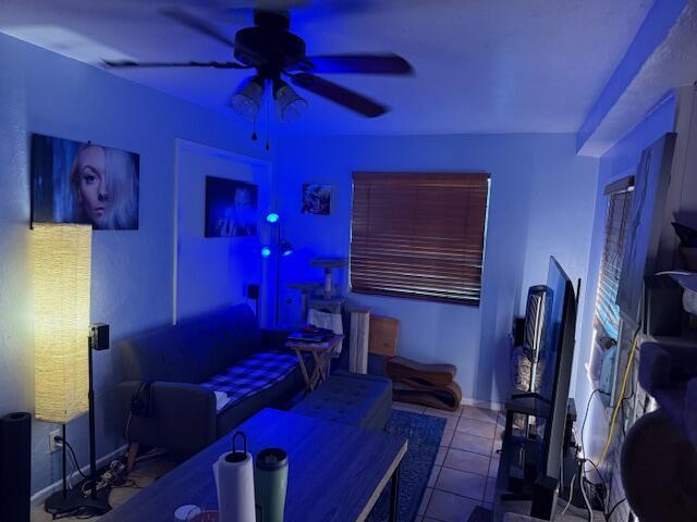 1831 Juno Rd Unit 123, North Palm Beach, FL 33408 - living area with ceiling fan, tile patterned flooring, and baseboards