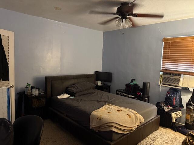 1831 Juno Rd Unit 123, North Palm Beach, FL 33408 - bedroom with ceiling fan and cooling unit