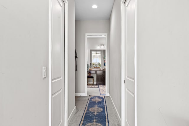 corridor featuring baseboards