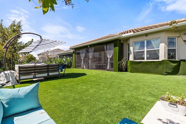 view of yard with an outdoor hangout area and a sunroom