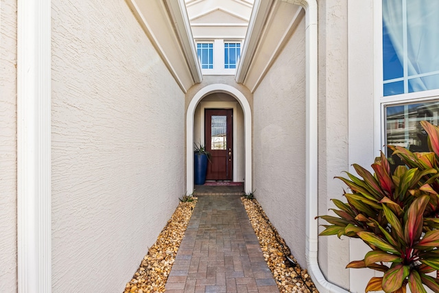 doorway to property with stucco siding