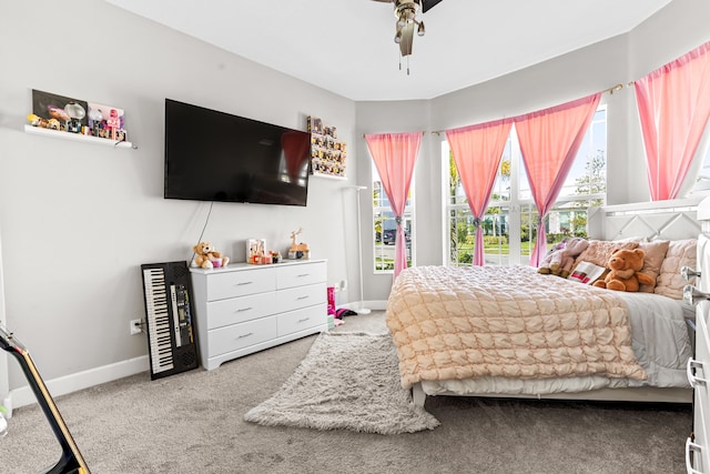 bedroom featuring baseboards, carpet, and a ceiling fan