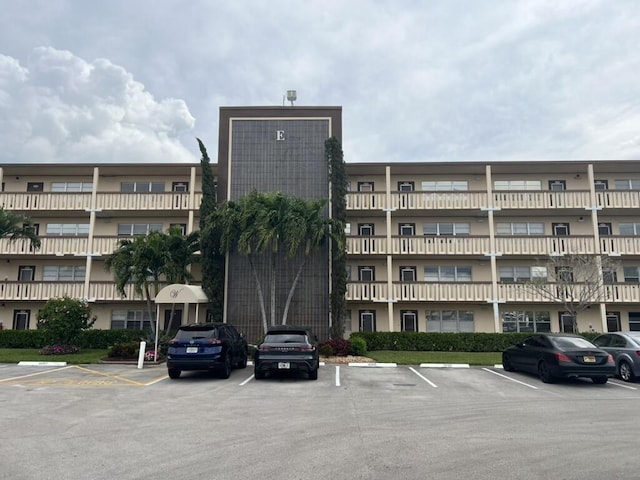 view of property with uncovered parking