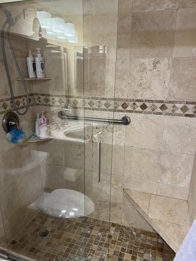 full bathroom featuring a shower stall