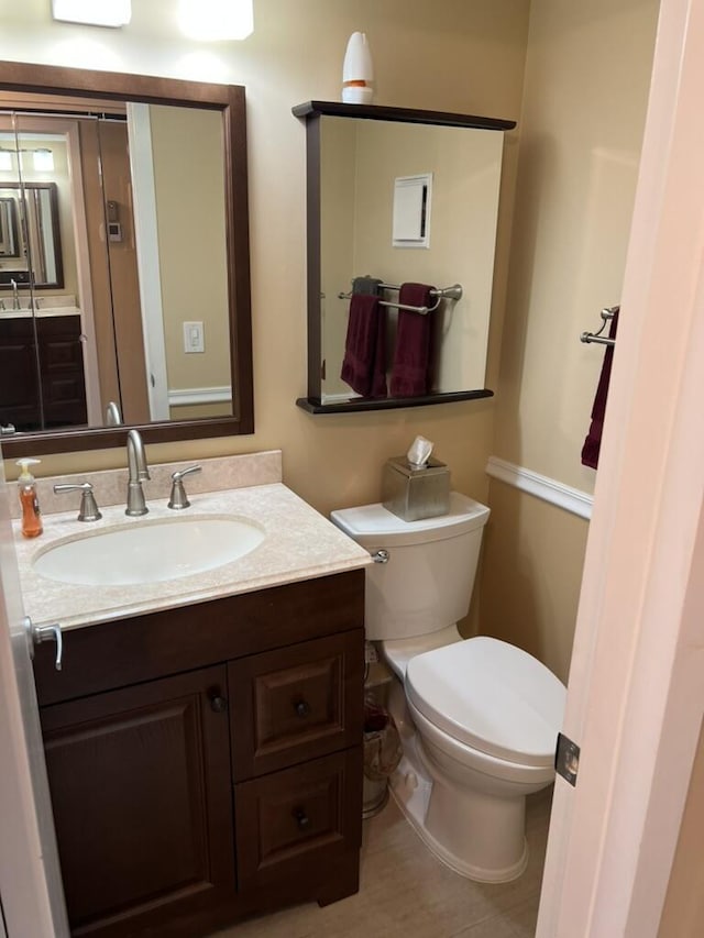 half bath with vanity and toilet