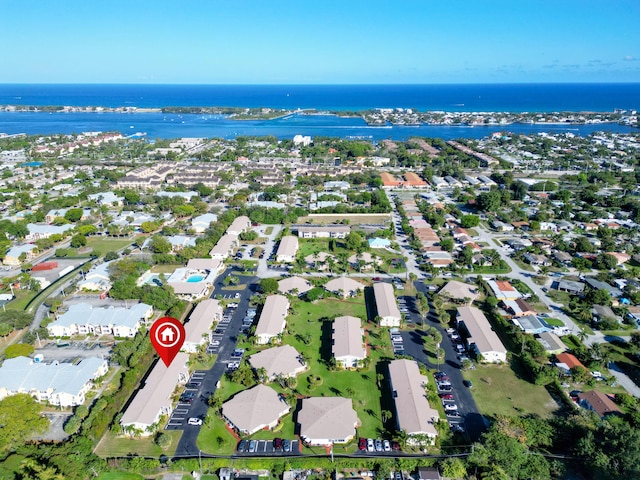 bird's eye view featuring a residential view and a water view