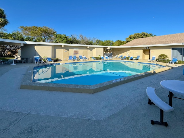 pool with a patio