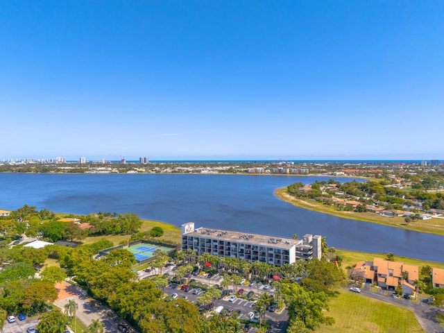 birds eye view of property with a view of city and a water view