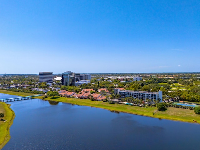 drone / aerial view featuring a water view and a city view