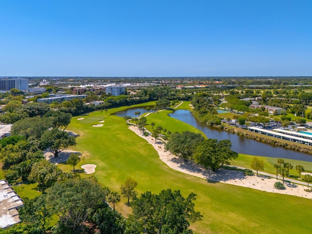 aerial view featuring golf course view and a water view