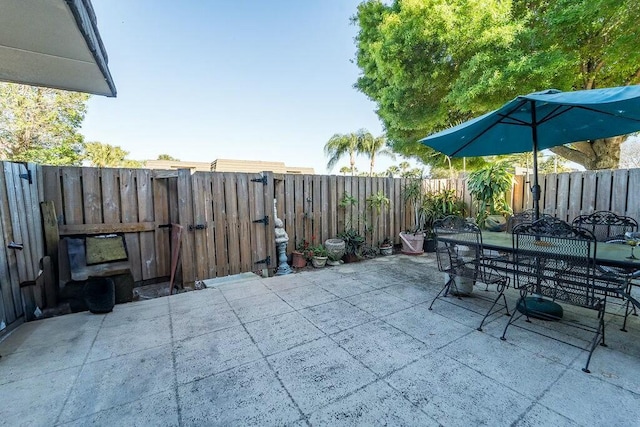 view of patio / terrace with outdoor dining space and a fenced backyard