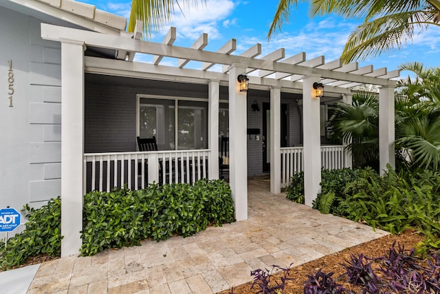 exterior space featuring a porch and a pergola