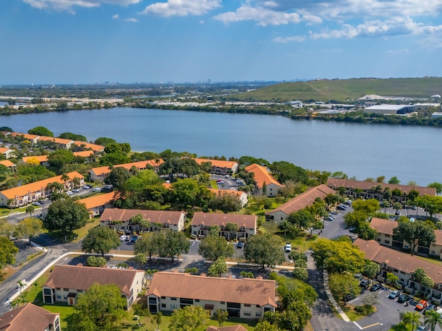 bird's eye view with a water view and a residential view