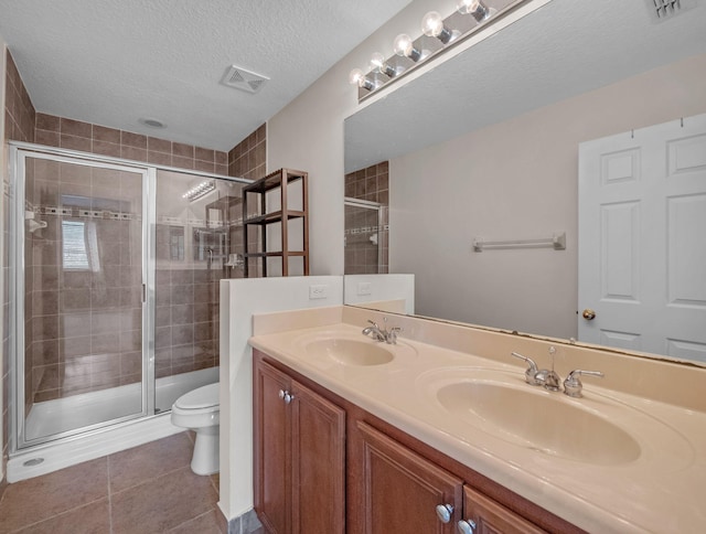 2185 SW Rockport Rd, Port Saint Lucie, FL 34953 - full bath featuring a stall shower, visible vents, a sink, and toilet