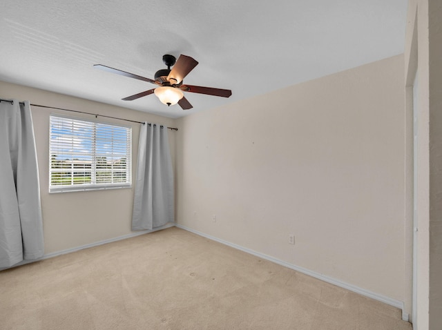 2185 SW Rockport Rd, Port Saint Lucie, FL 34953 - carpeted spare room featuring a ceiling fan and baseboards