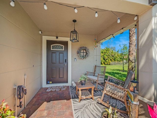 doorway to property with a porch