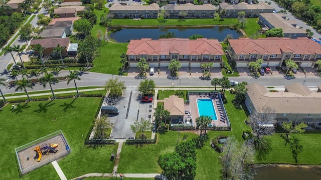 bird's eye view with a residential view and a water view