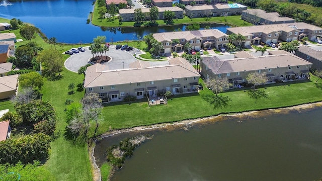 aerial view featuring a residential view and a water view