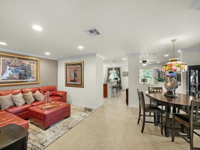 living area featuring recessed lighting, visible vents, baseboards, and ornamental molding