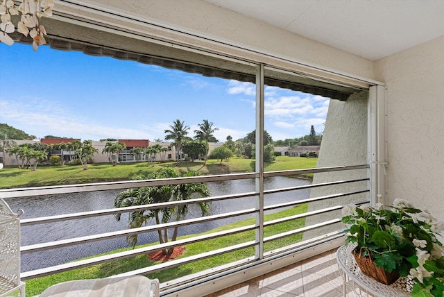 balcony with a water view and a residential view