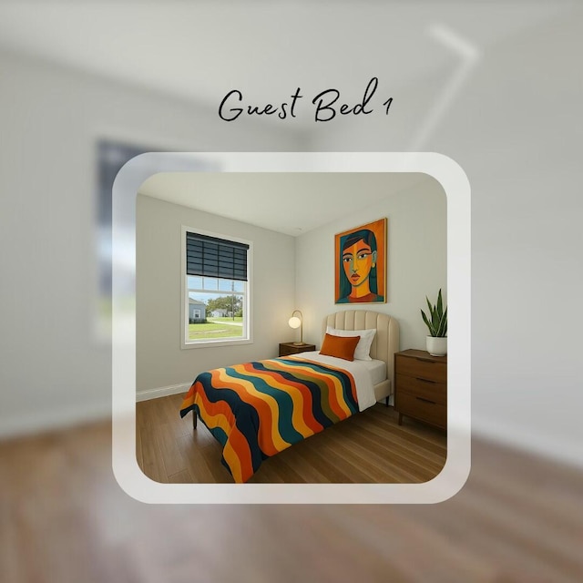 bedroom with baseboards and wood finished floors