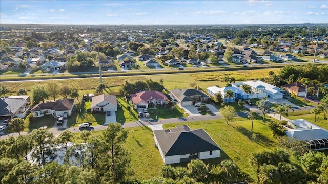 birds eye view of property with a residential view