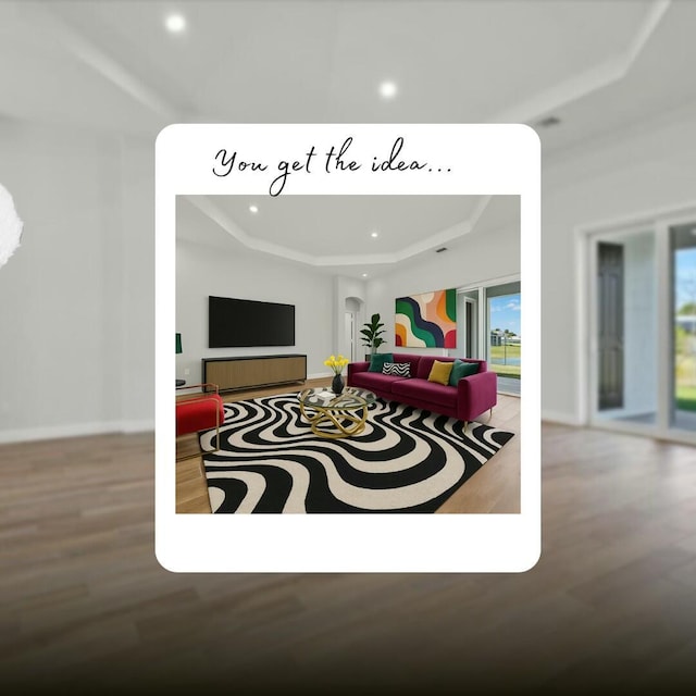 living room with baseboards, wood finished floors, a tray ceiling, and recessed lighting