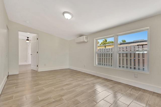 unfurnished room with baseboards, an AC wall unit, a ceiling fan, and wood tiled floor
