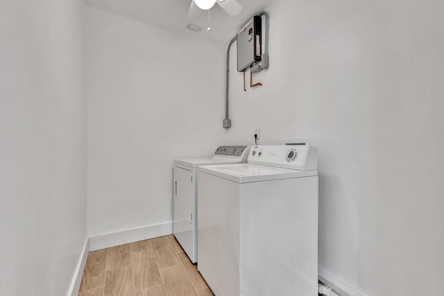 laundry room featuring ceiling fan, laundry area, baseboards, and washer and clothes dryer
