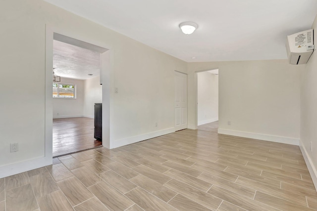 spare room with baseboards and wood tiled floor