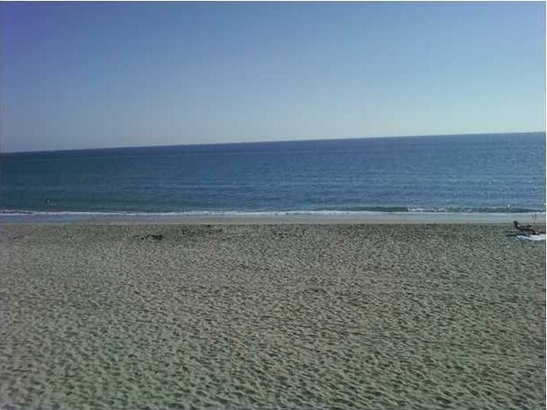 property view of water featuring a beach view