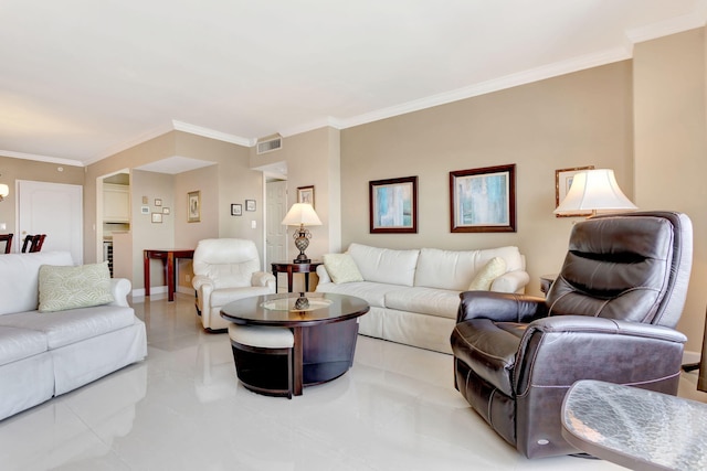 living room featuring baseboards, visible vents, and ornamental molding