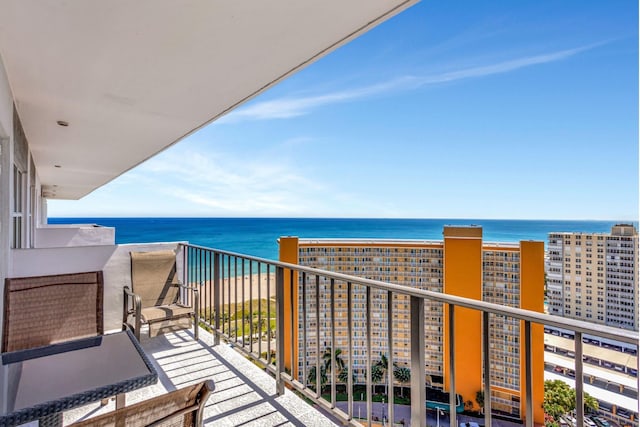 balcony featuring a water view