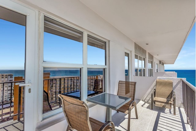 balcony featuring a water view