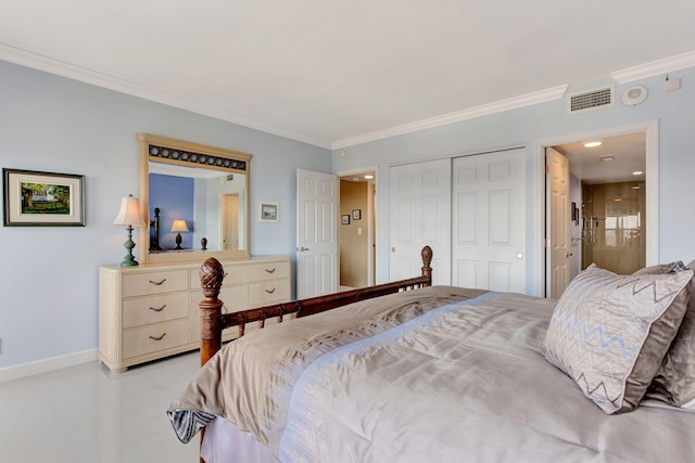 bedroom with visible vents, baseboards, ornamental molding, a closet, and ensuite bath