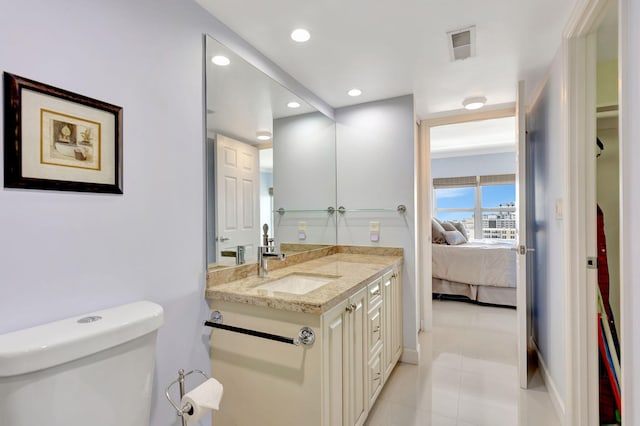 bathroom with visible vents, toilet, recessed lighting, connected bathroom, and vanity