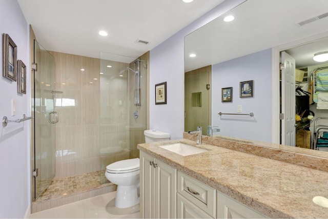 full bath featuring visible vents, vanity, toilet, and a shower stall