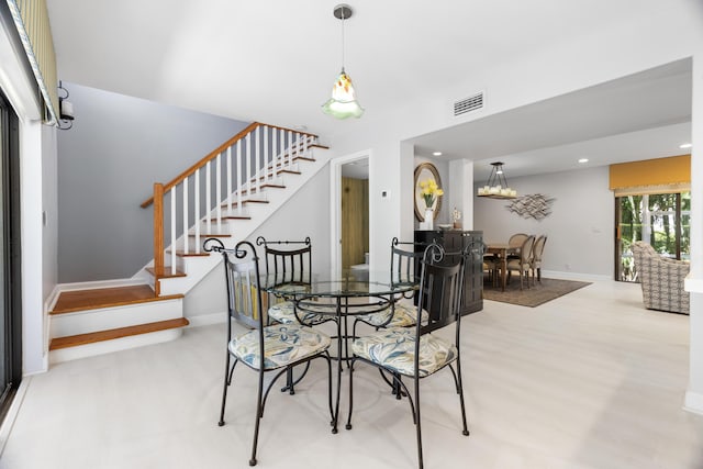 dining space featuring visible vents, baseboards, stairs, recessed lighting, and wood finished floors