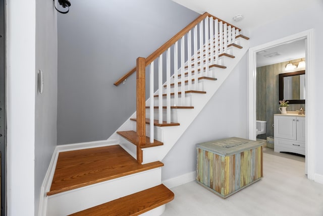 stairs featuring baseboards