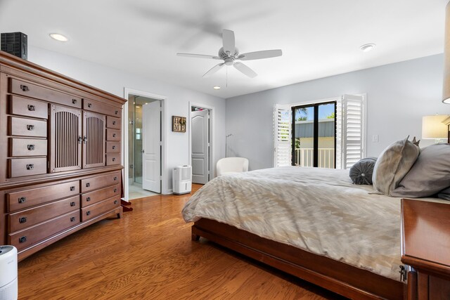 bedroom featuring wood finished floors, ensuite bath, recessed lighting, ceiling fan, and access to outside