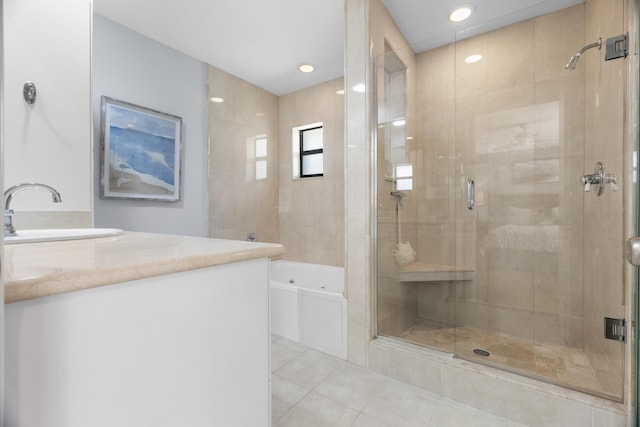 full bath with vanity, tile patterned floors, and a stall shower